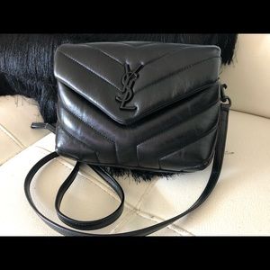 Saint Laurent black on black crossbody handbag.